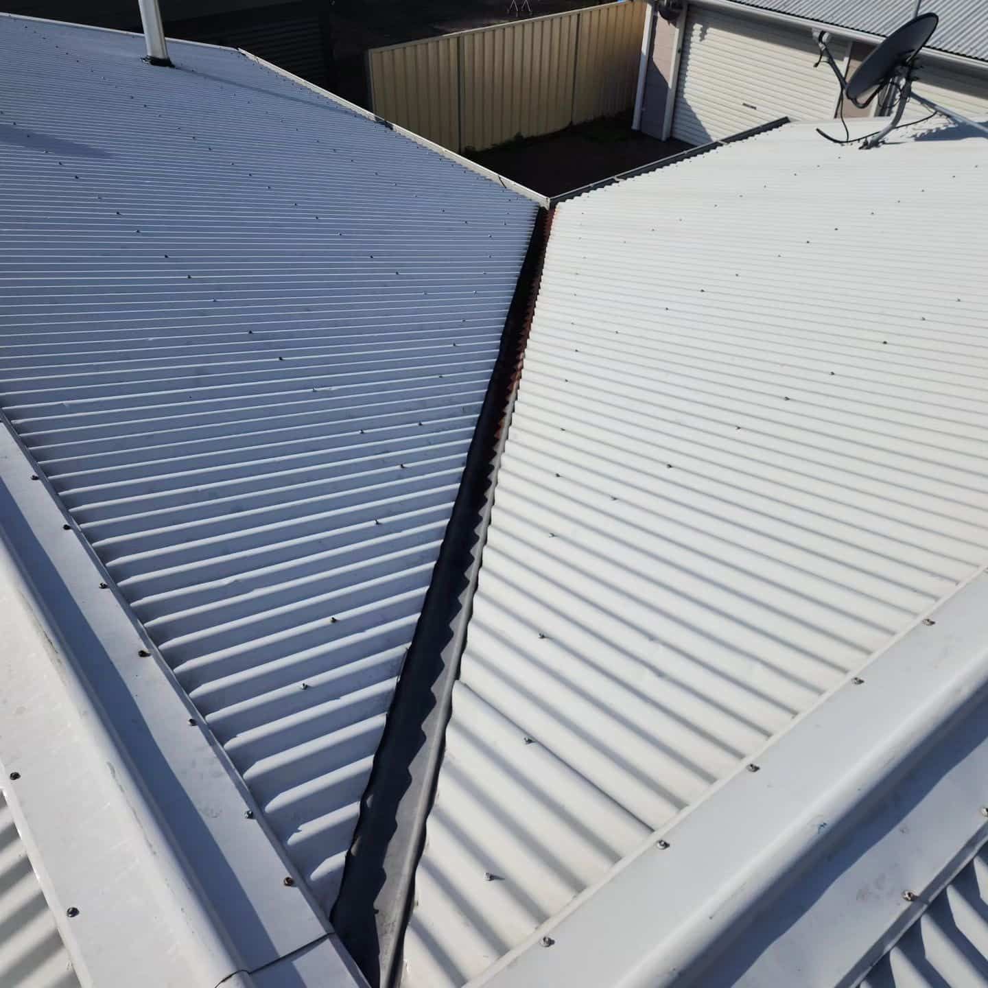 A White Roof With a Satellite Dish — Exquisite Exterior Cleaning In Central Coast, NSW