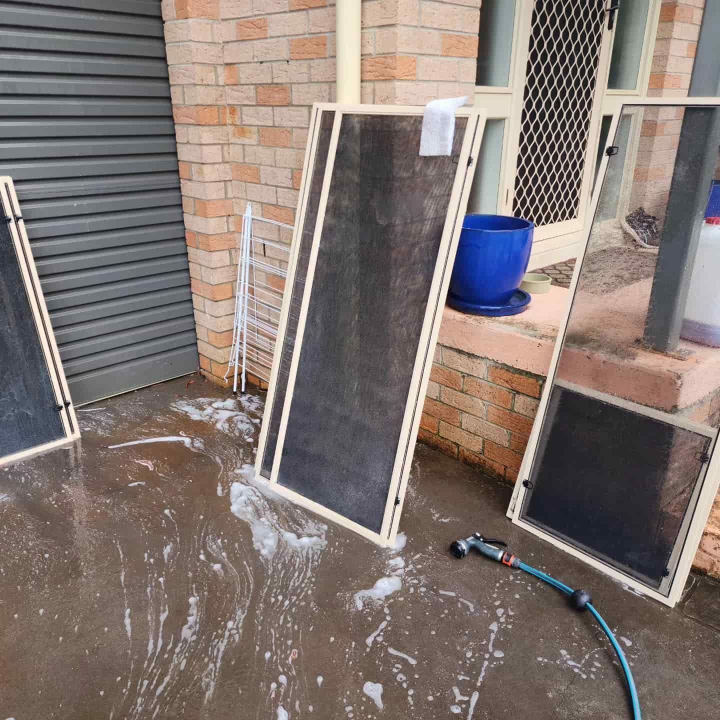 A Hose is Sitting on the Ground — Exquisite Exterior Cleaning In North Gosford, NSW