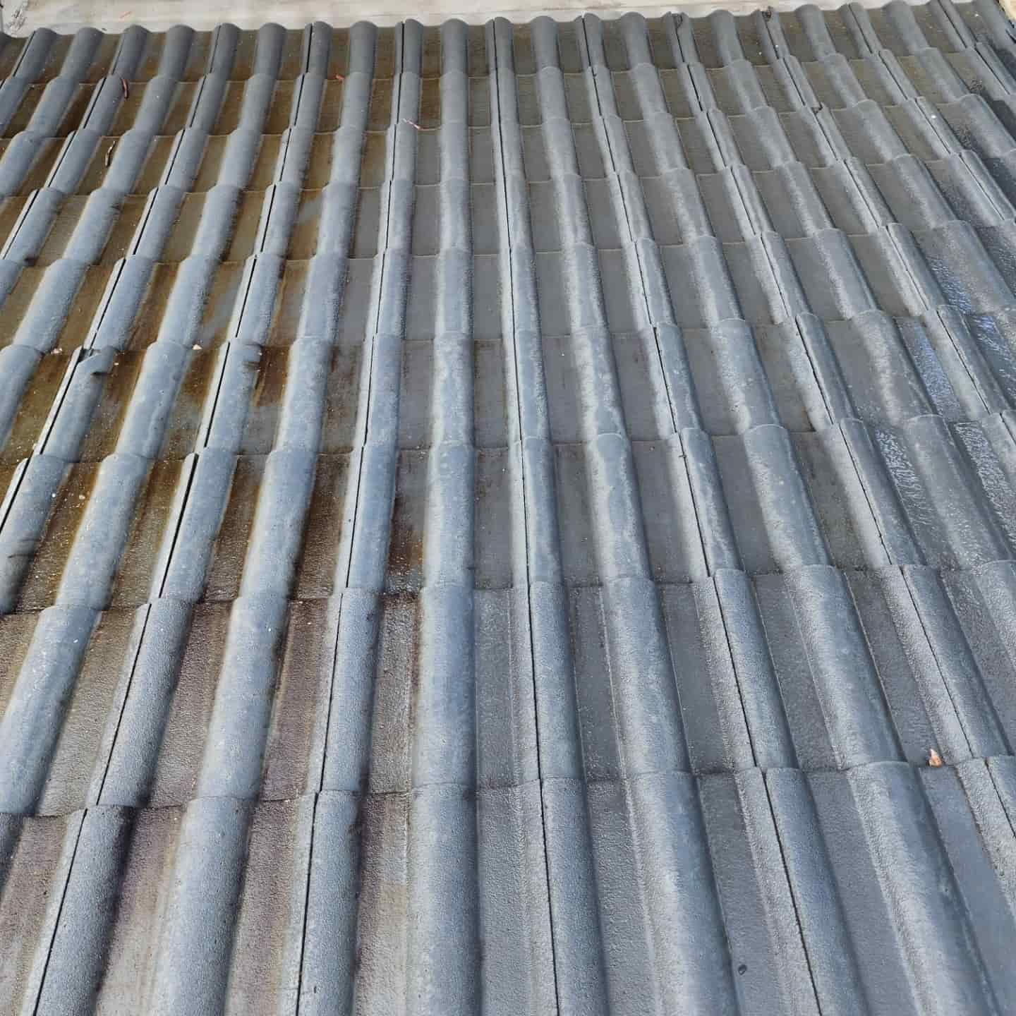 Wavy Gray Rooftop With Visible Rust Stains — Exquisite Exterior Cleaning in North Gosford, NSW