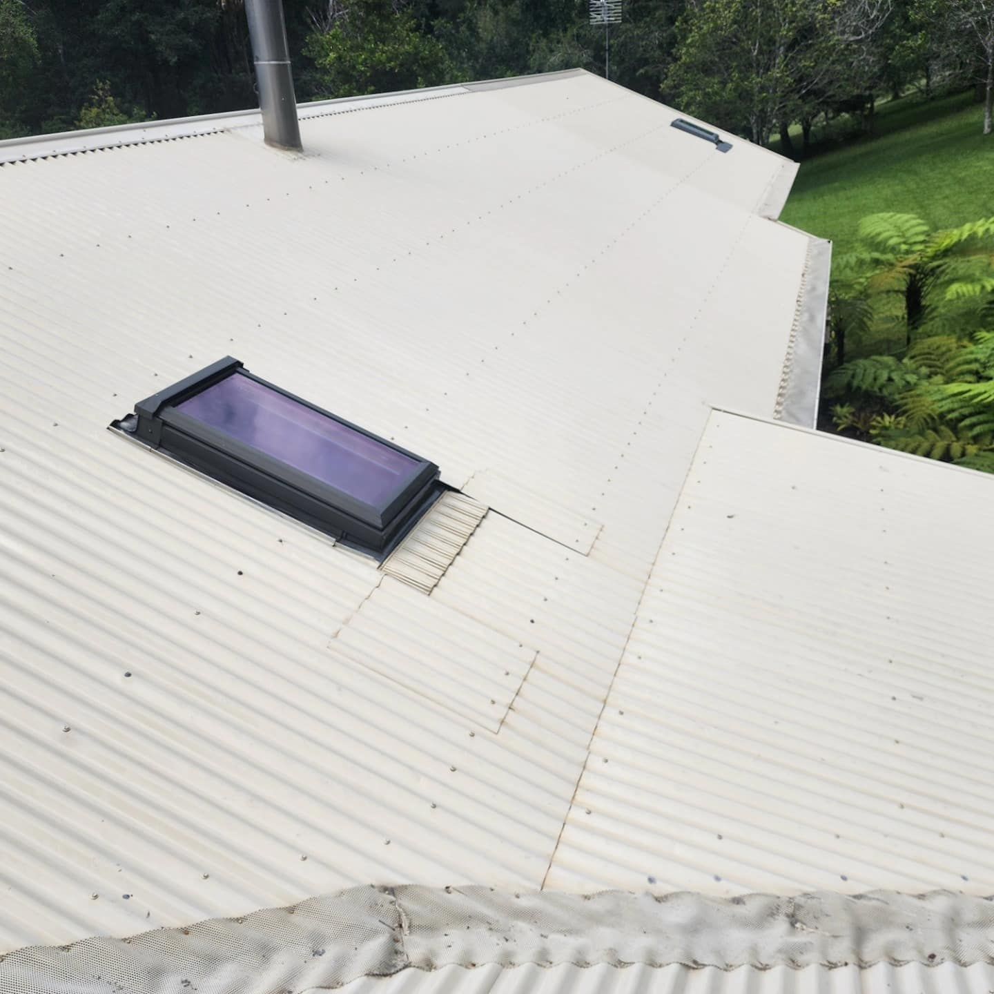 A White Roof With a Skylight — Exquisite Exterior Cleaning In Central Coast, NSW