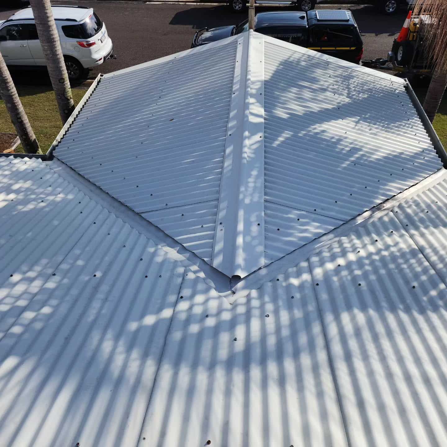 Roof With White Corrugated Metal Panels — Exquisite Exterior Cleaning In Gosford, NSW