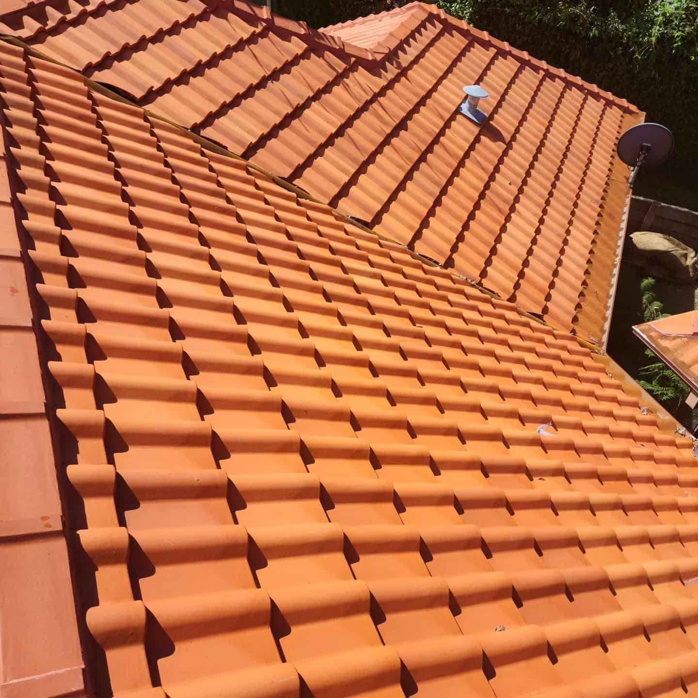 Orange Clay Roof Tiles Cover a House — Exquisite Exterior Cleaning In Tuggerah, NSW