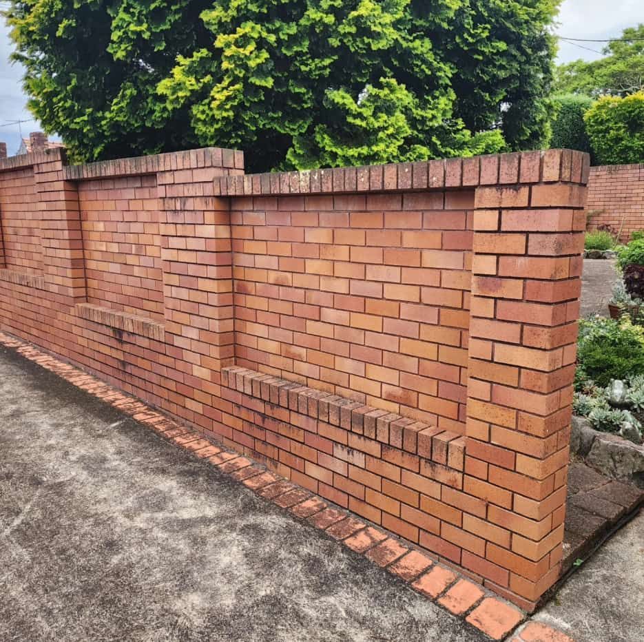 A Red Brick Wall With Two Narrow Ledges — Exquisite Exterior Cleaning In Umina Beach, NSW