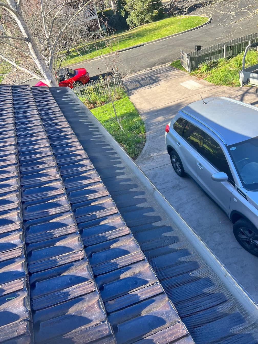Gutter guard installed on a roof