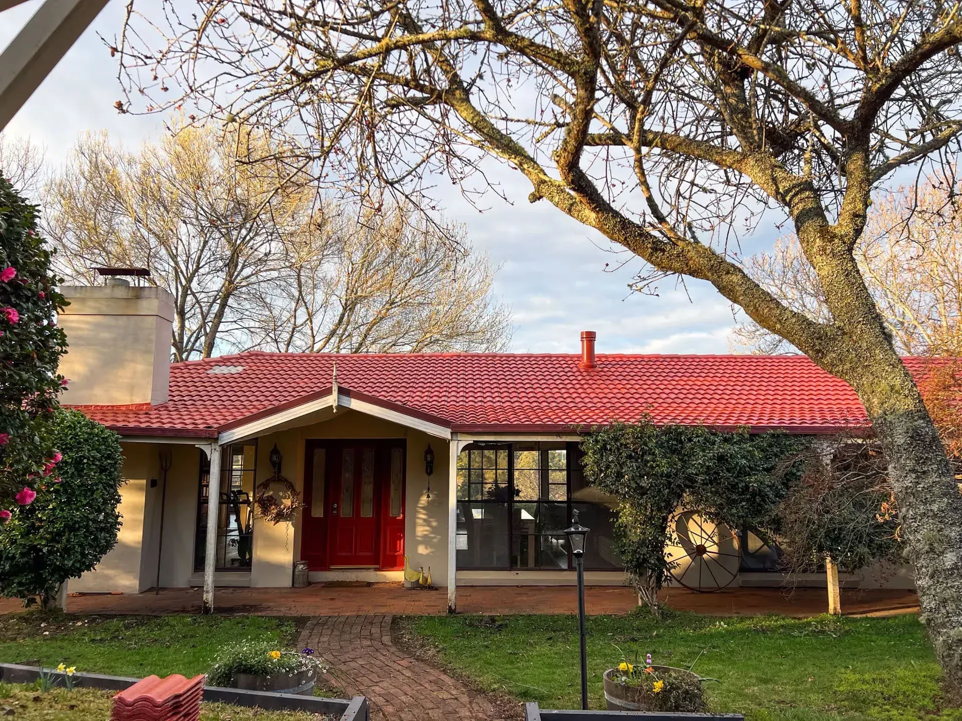 A house with a red roof and a red door