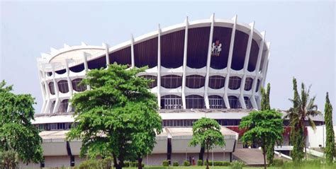 A large building with trees in front of it