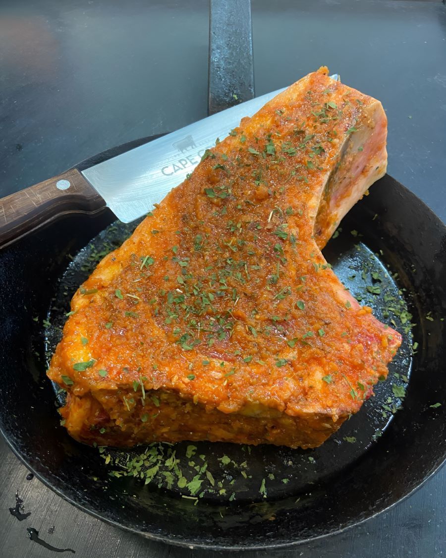 Coated meat with toppings of green leaves β Prime Meats NT in Coconut Grove, NT