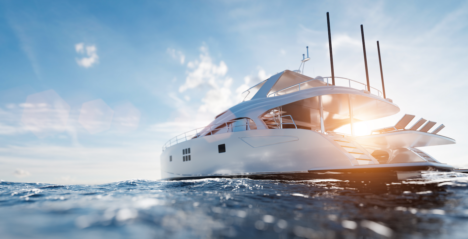 A large white yacht is floating on top of a body of water.