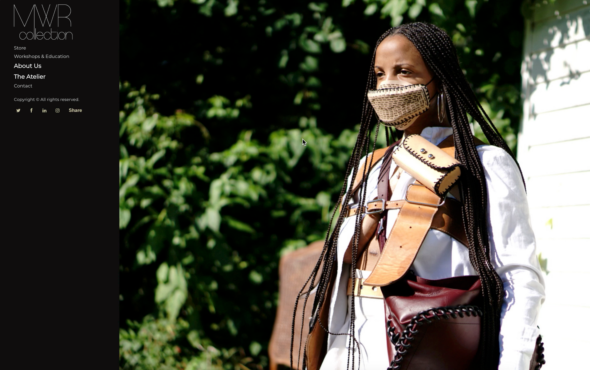 MWR Collection's old homepage design. A woman with long braided hair wearing leather accesories standing outdoors.