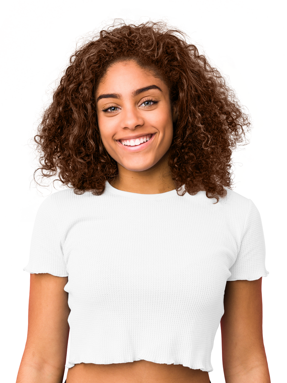 a woman with curly hair is wearing a white crop top and smiling .