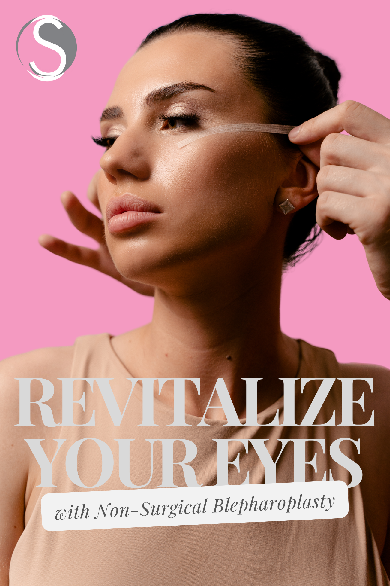 A woman is applying a serum to her eyes on a pink background.