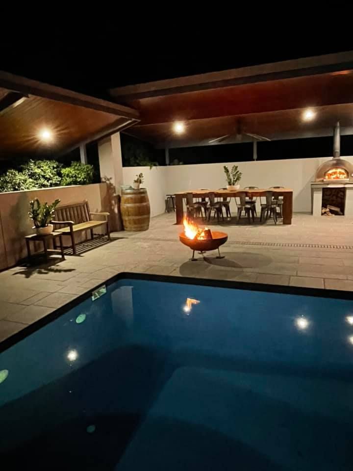 There Is A Fire Pit In The Middle Of The Pool — Yamba Pools & Spas In Townsend, NSW