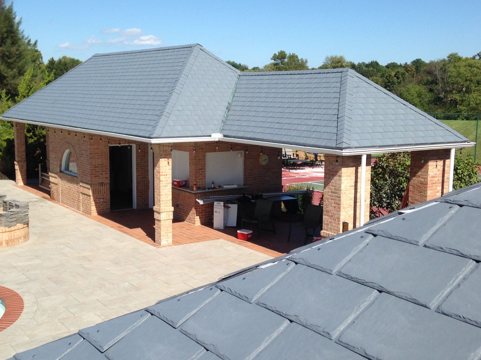 A large brick building with a gray roof