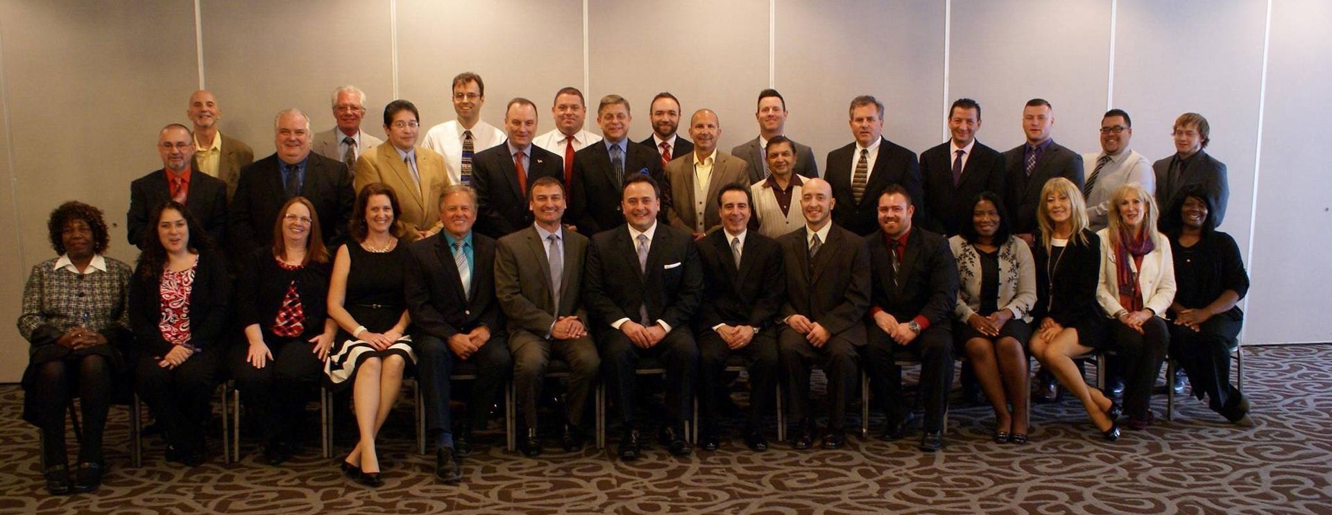 A large group of people are posing for a picture