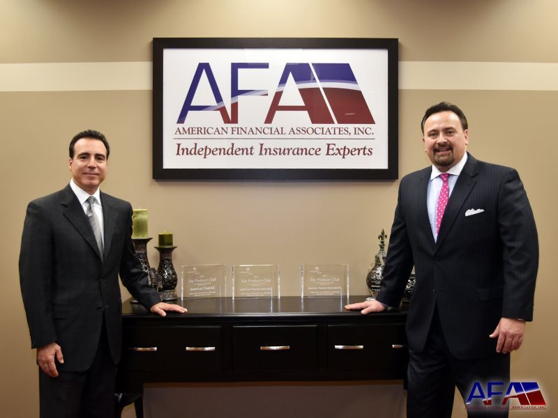 Two men are standing in front of an afa sign