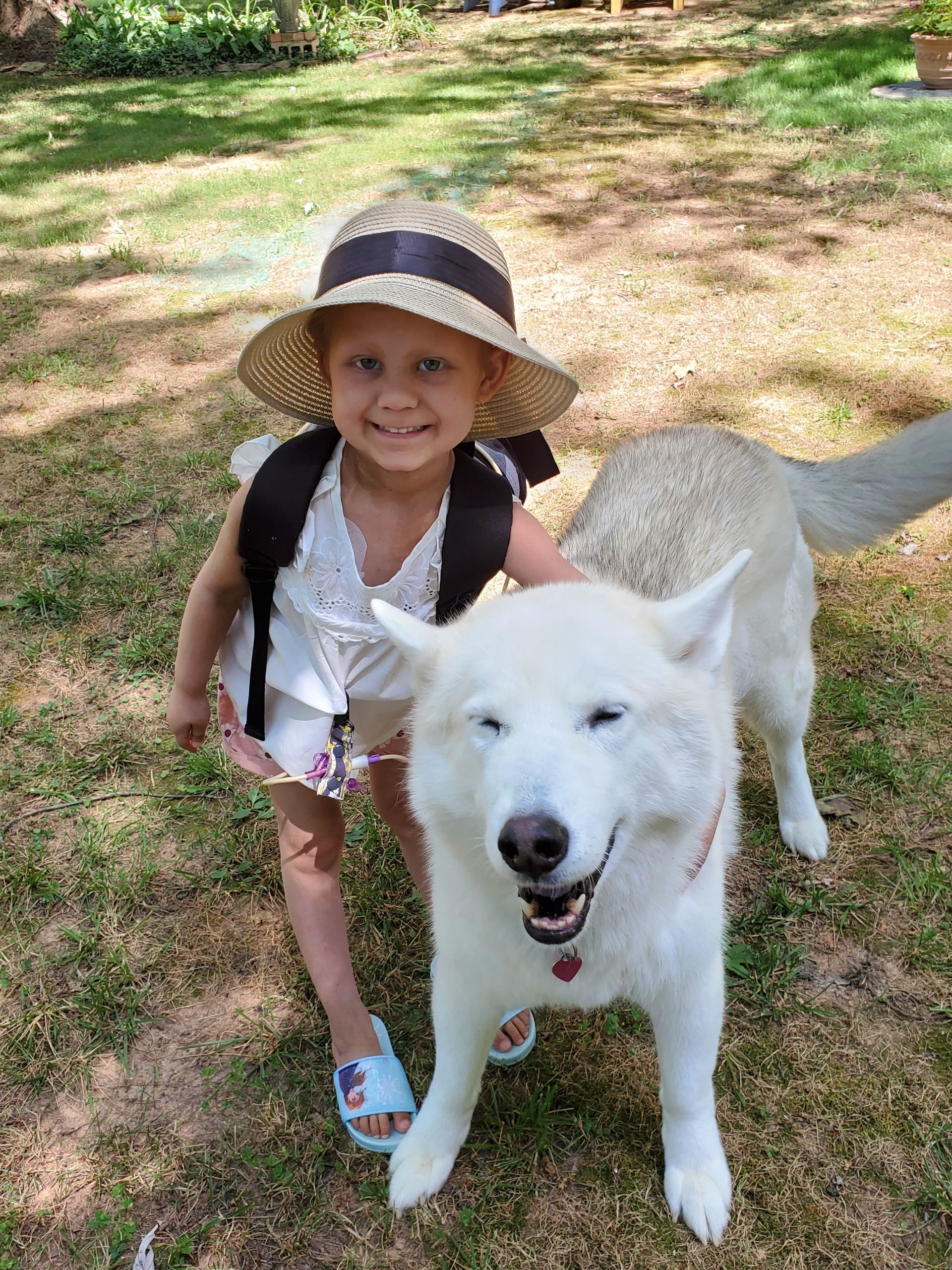 LBF Hero Abby Cafiero with her dog and wearing hat