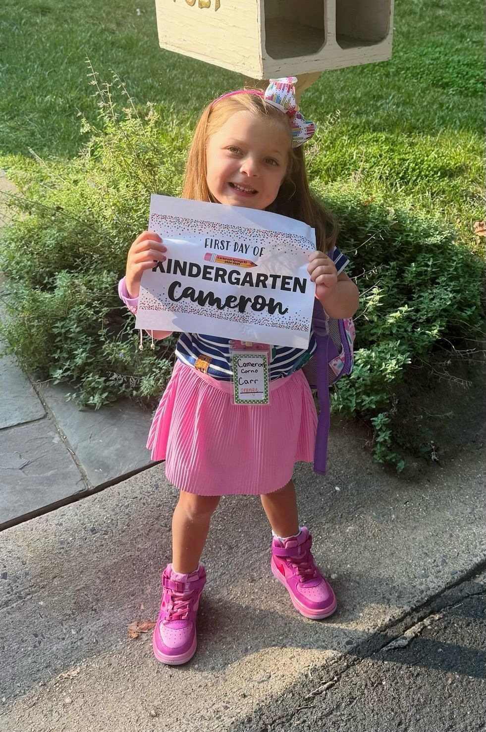 LBF Hero Cameron Corno holding kindergarten sign