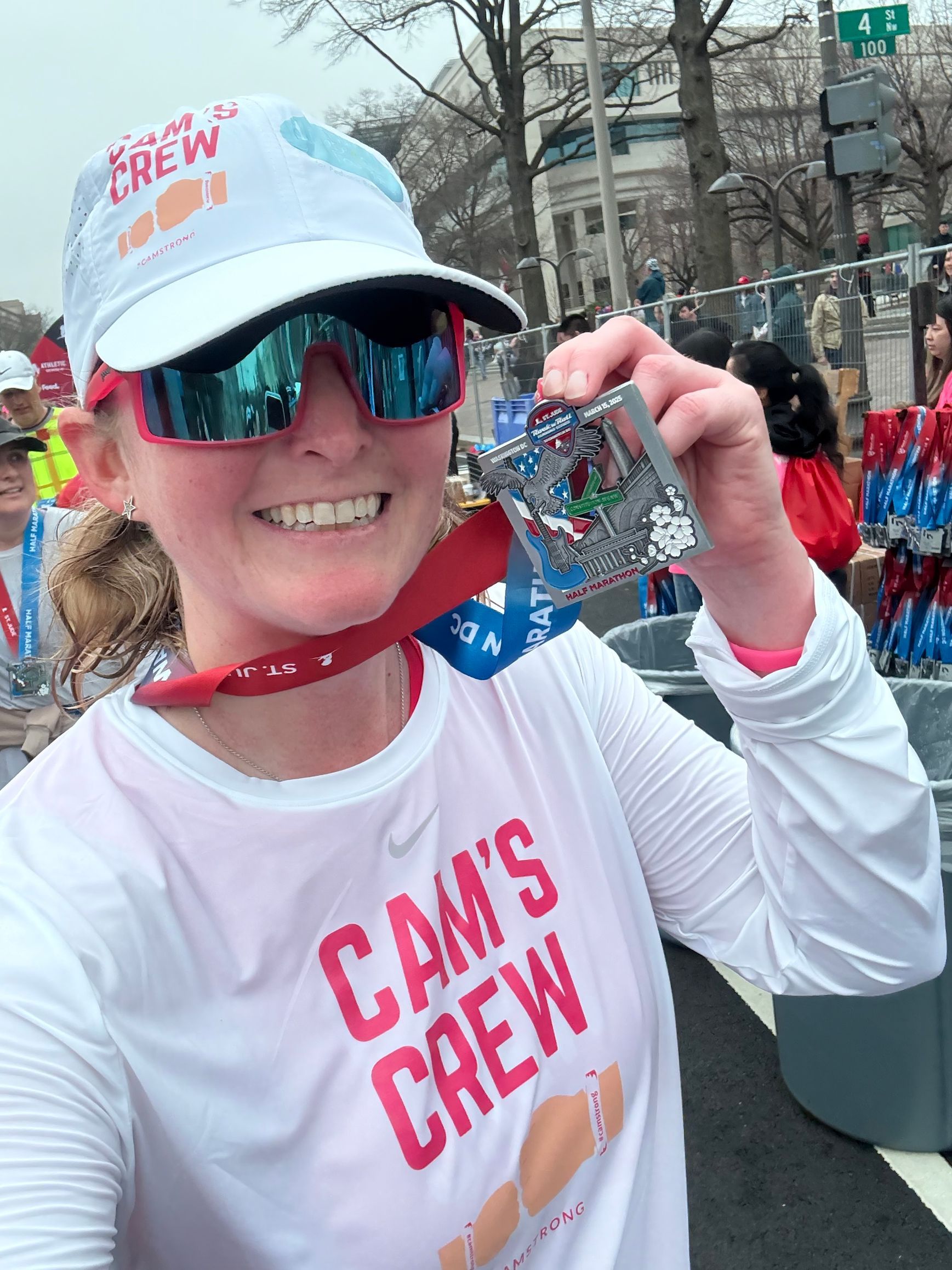 Justine Corno holding her race medal