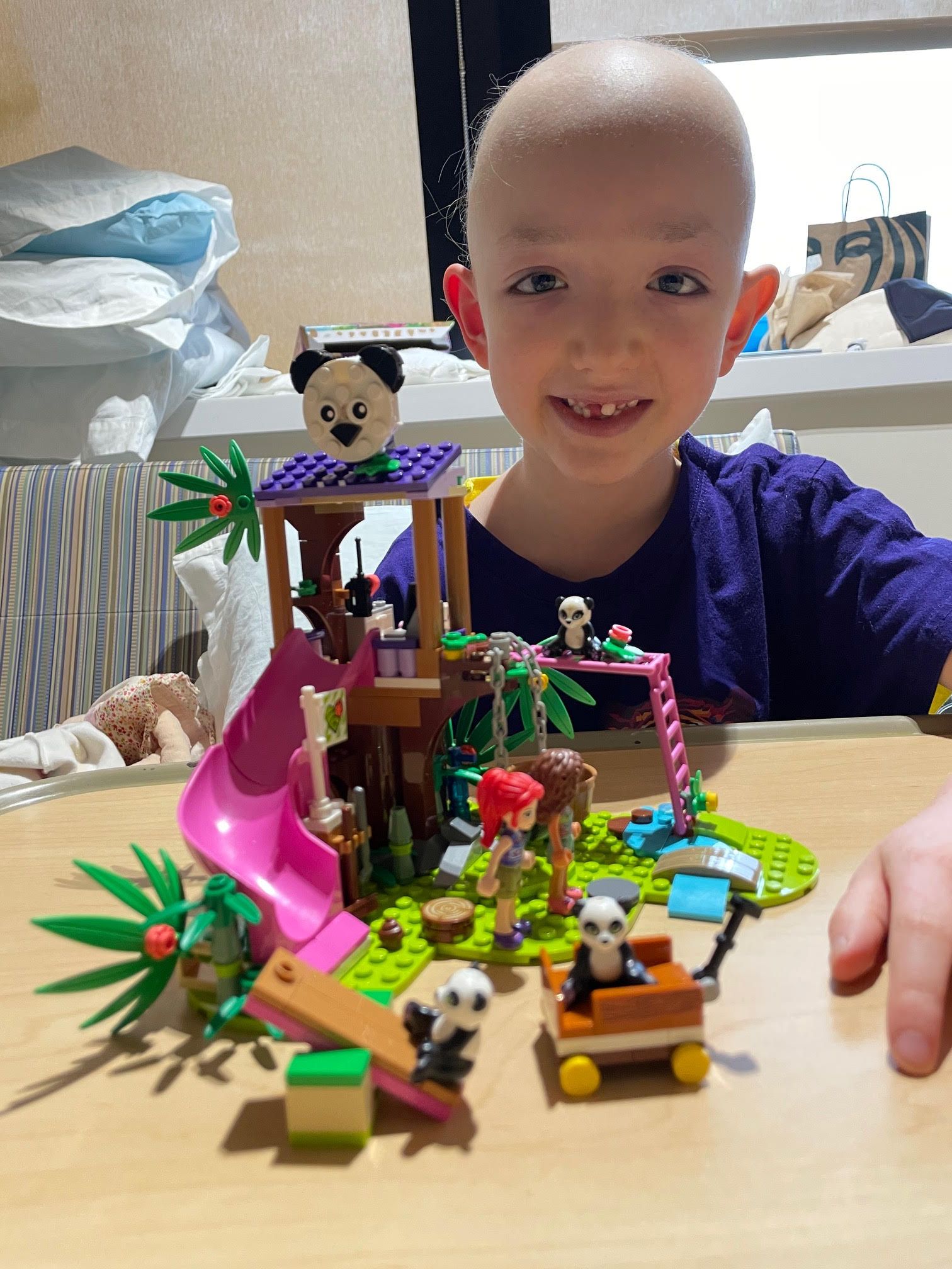 LBF Hero Kasey playing with toys on a table