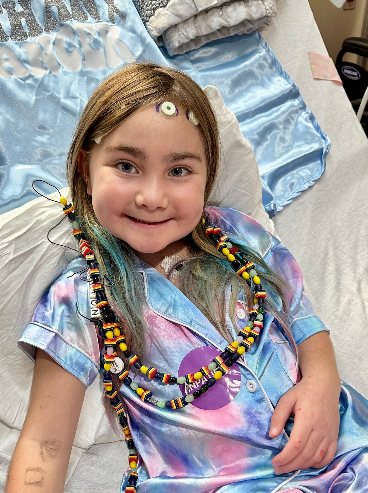 LBF Hero Ashton Hawkings lying in hospital bed