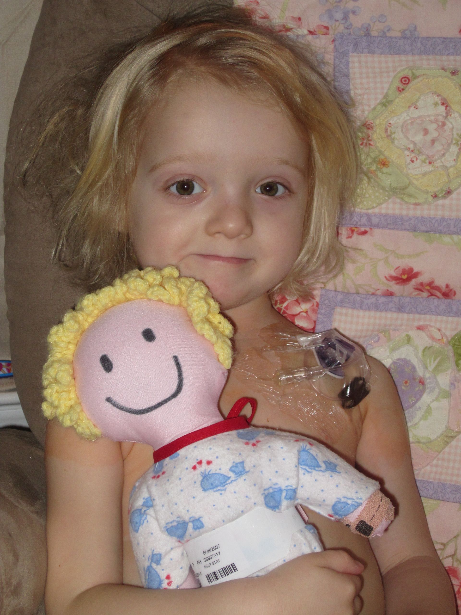 LBF Hero Zoe FitzGerald holding a doll
