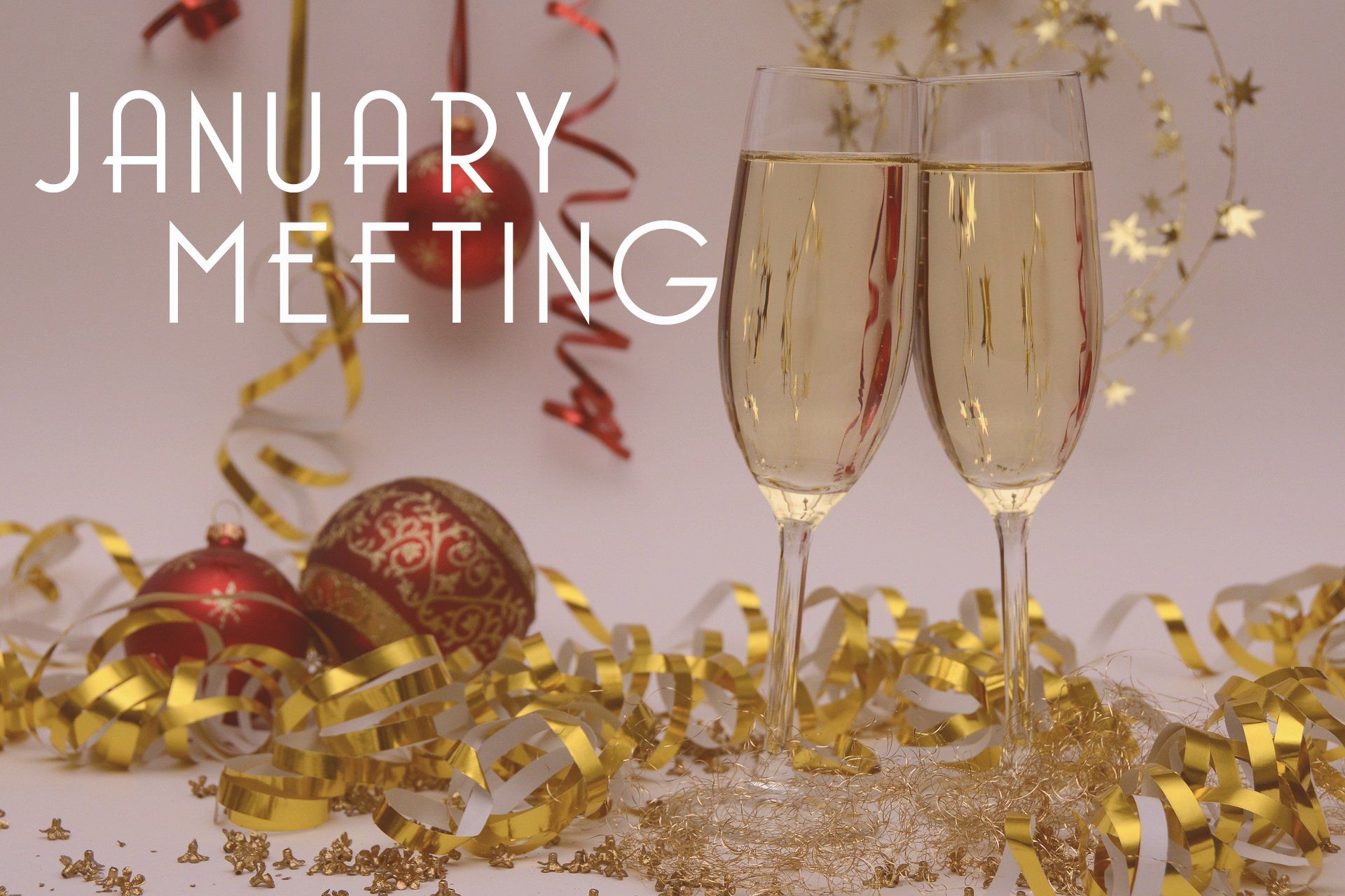 champagne glasses surrounded by red and gold decorations