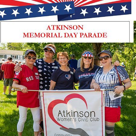 Members of the AWCC holding a banner at the Memorial Day Parade.