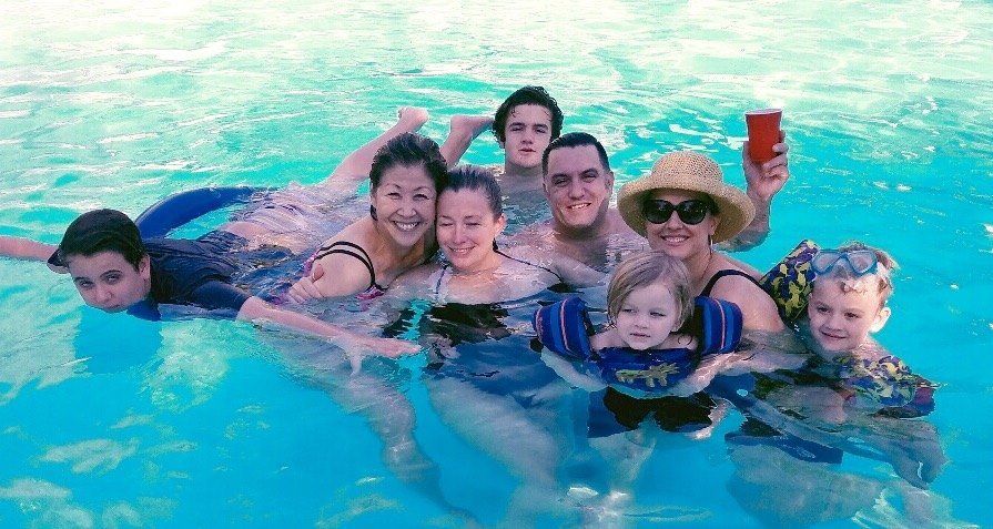 Maryann Ehmann with family in a swimming pool