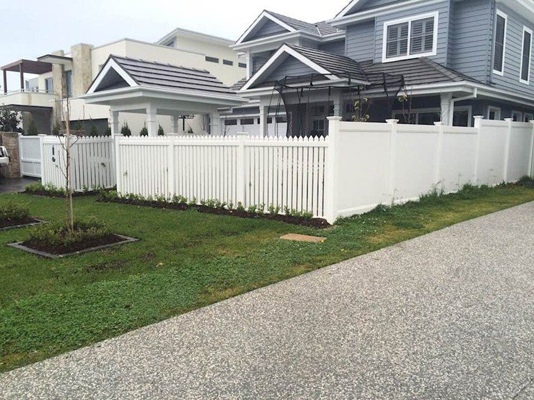 Residential House With White Fence — Professional Fencing in Taree, NSW