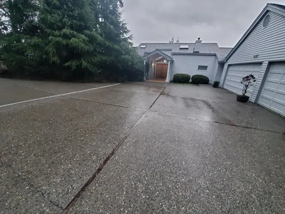 Pressure washing driveway in Bellingham, WA.