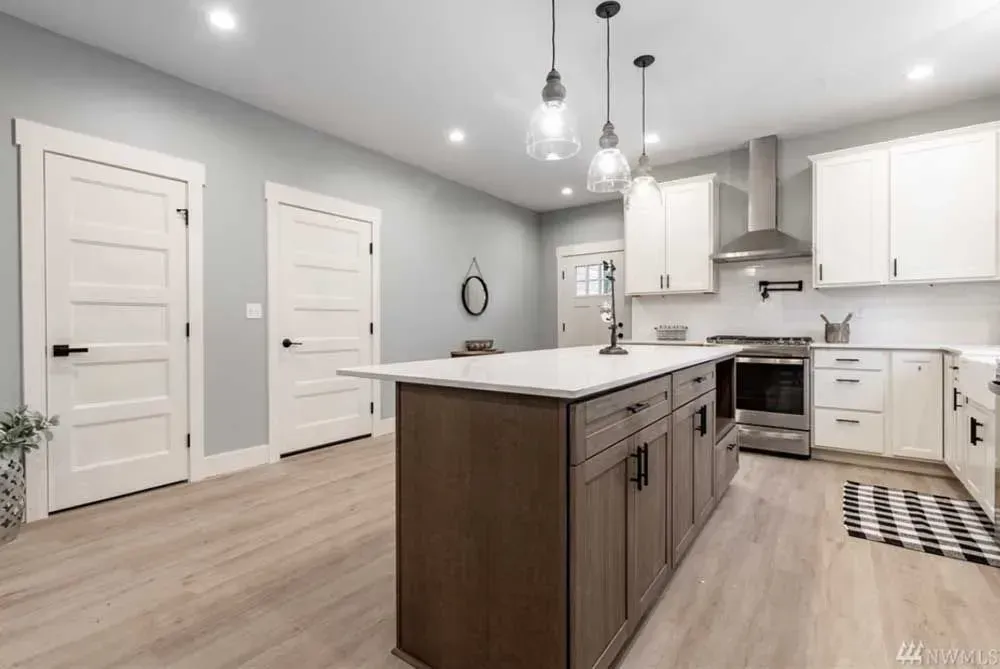 Kitchen with white cabinets and doors painting in Bellingham