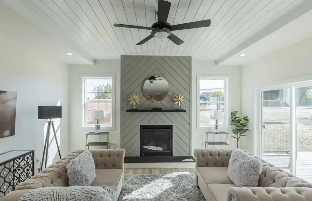 A living room with a fireplace and couches
