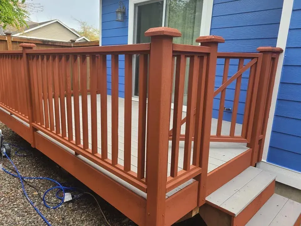 Close-up of freshly painted brown deck siding