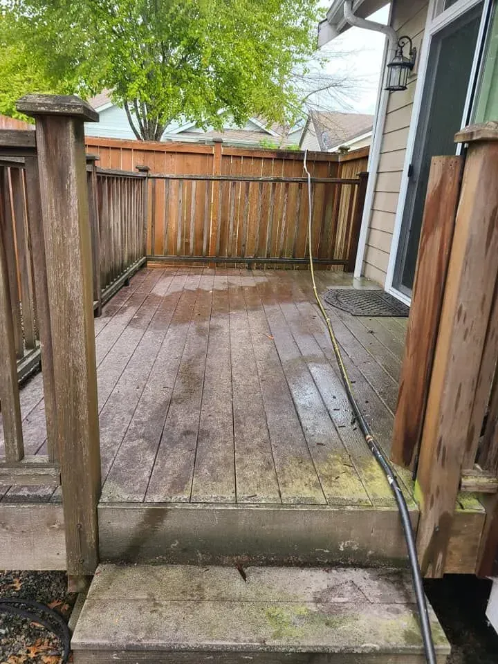 Photo showing a deck before pressure washing