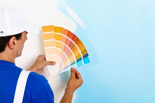 A Painting Expert in Washington doing professional painting services in a property in Washington