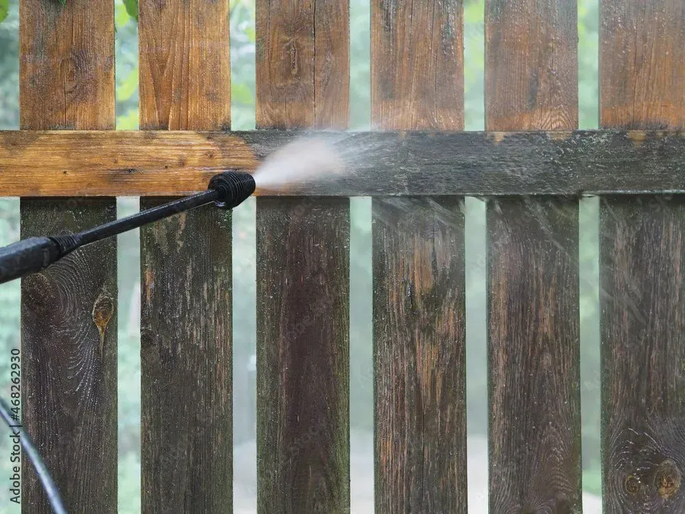 Next Step Painting  pressure washing a wooden fence
