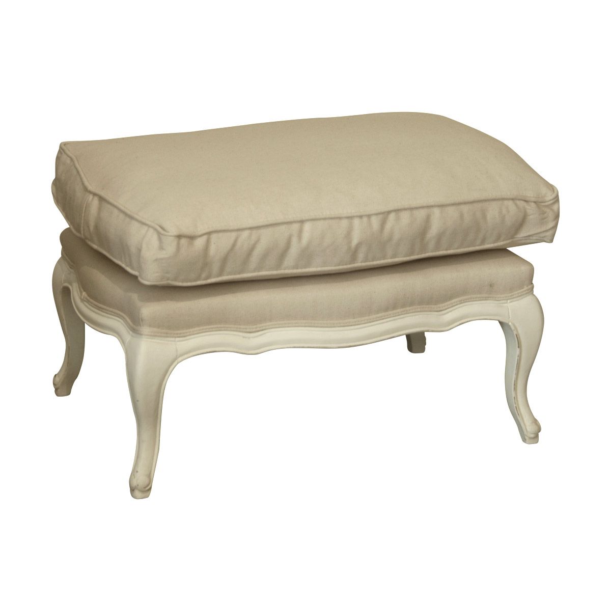 A footstool with linen fabric cushion and decoratively carved timber frame and legs.