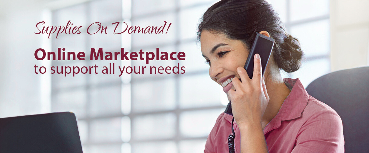 A woman in a pink shirt is talking on a cell phone
