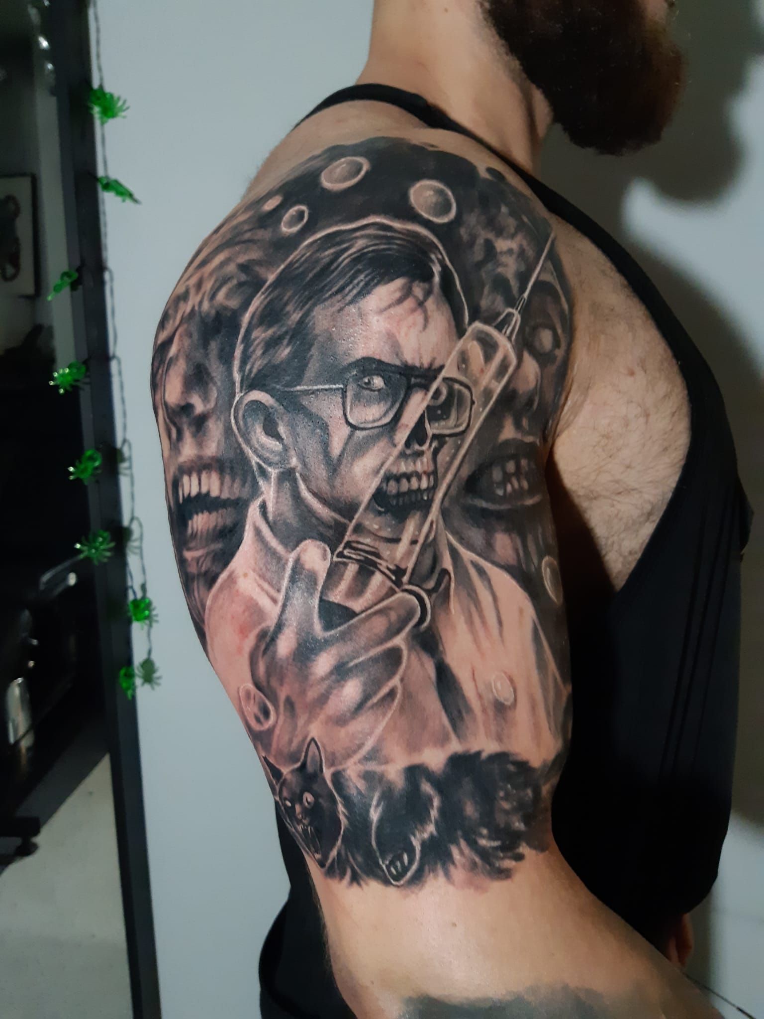 A man has a tattoo of a doctor holding a syringe on his arm.