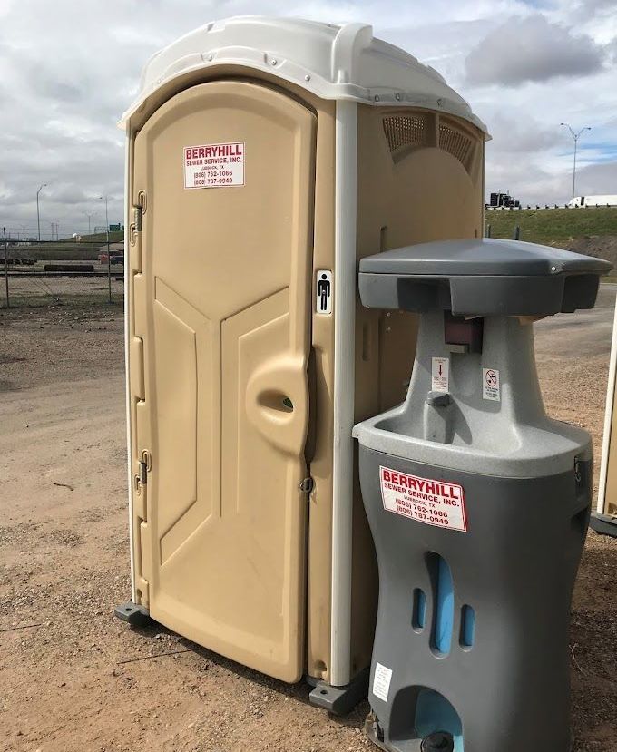 A Row of Blue and Gray Portable Toilets — Lubbock, TX — Berryhill Sewer Inc.