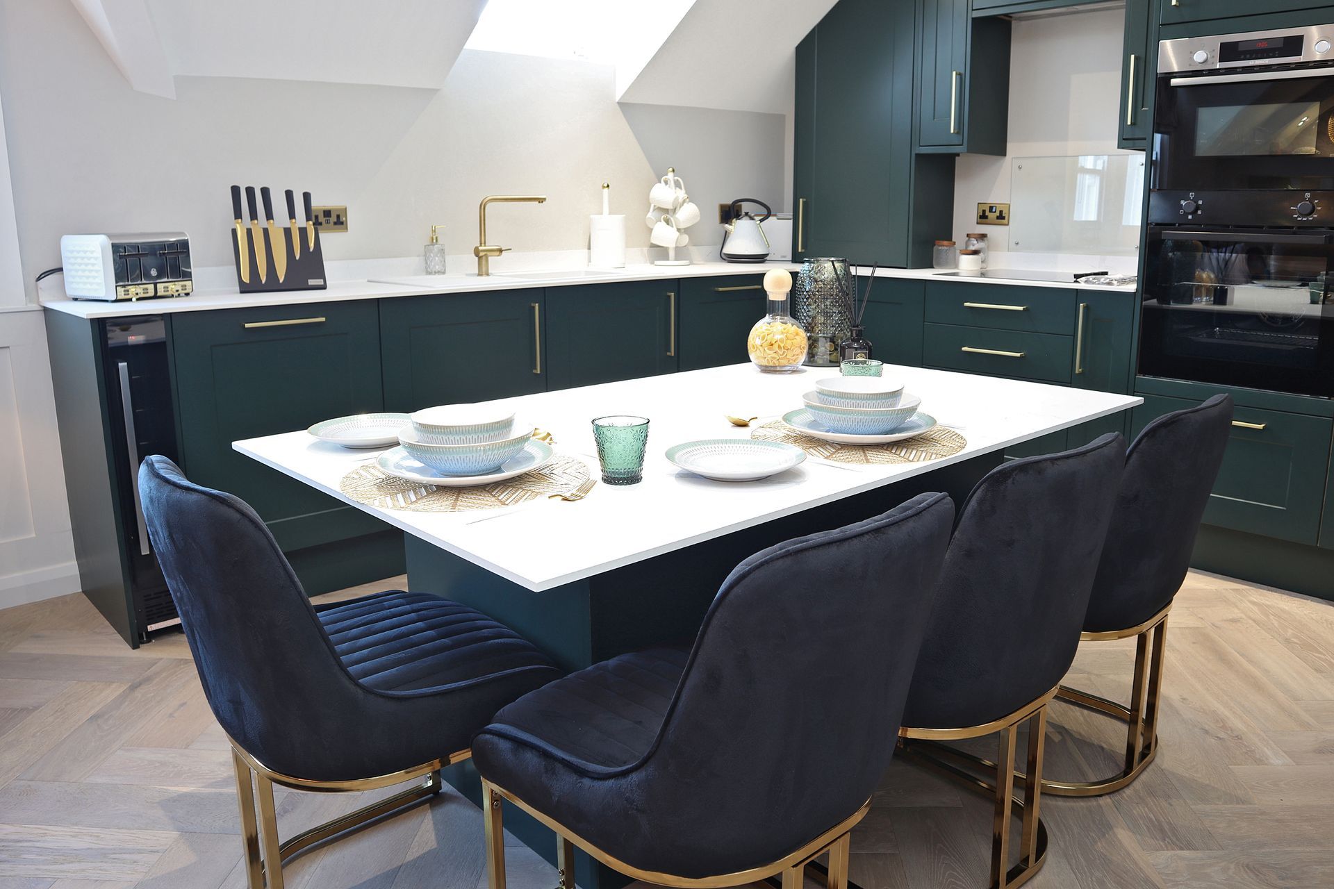 A kitchen with a table and chairs in it