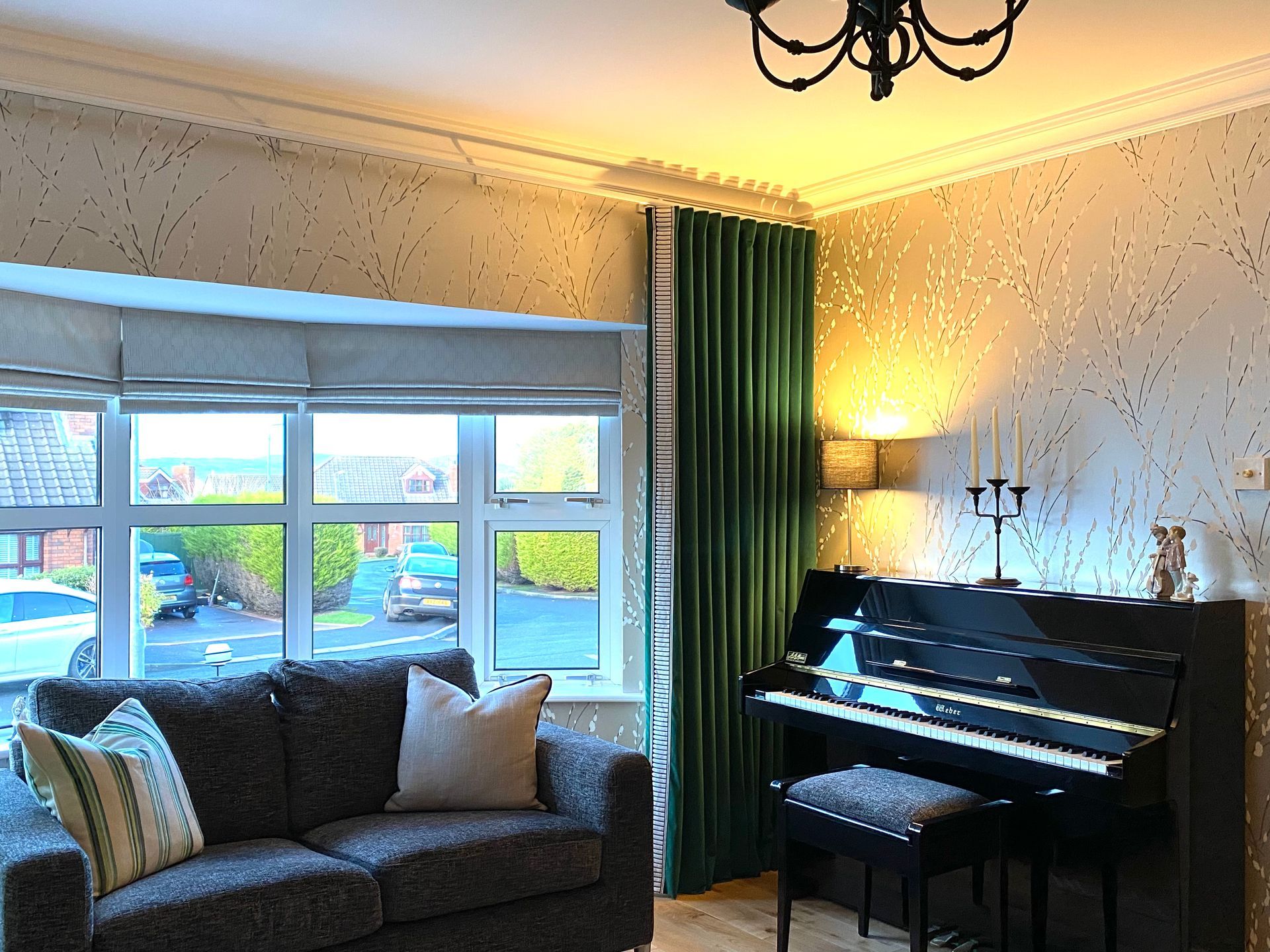 A living room with a piano and a couch