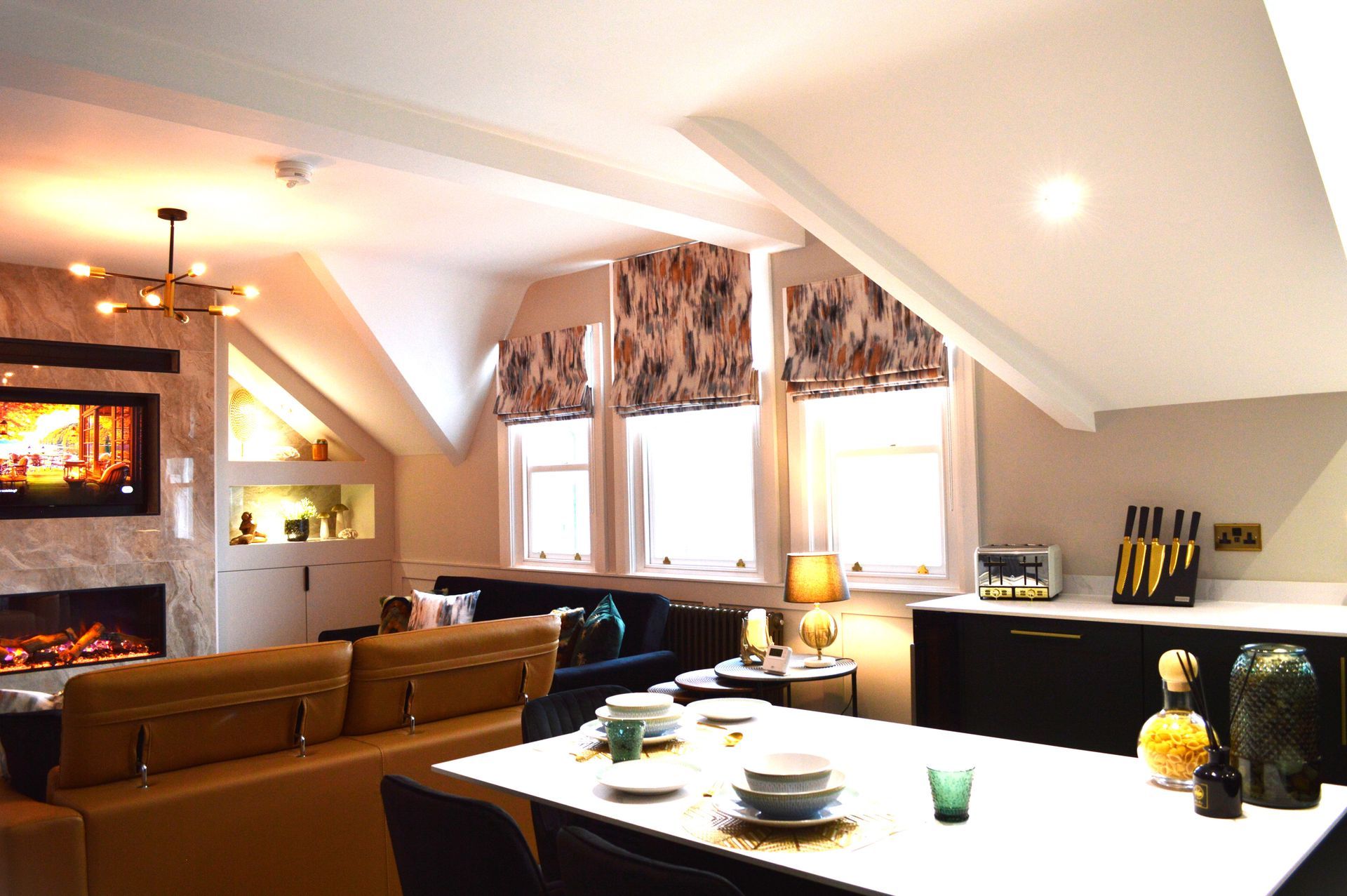 A living room with a dining table and a couch