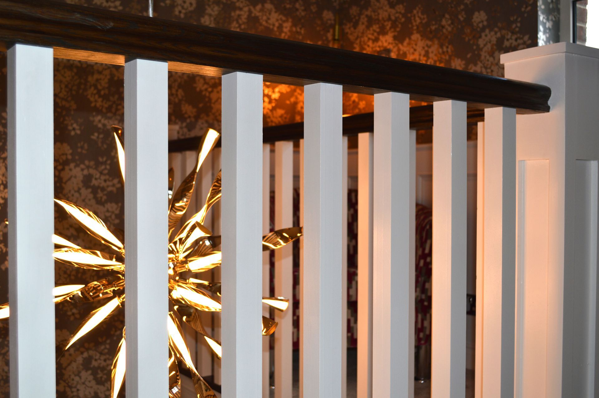 A white railing with a gold star on it