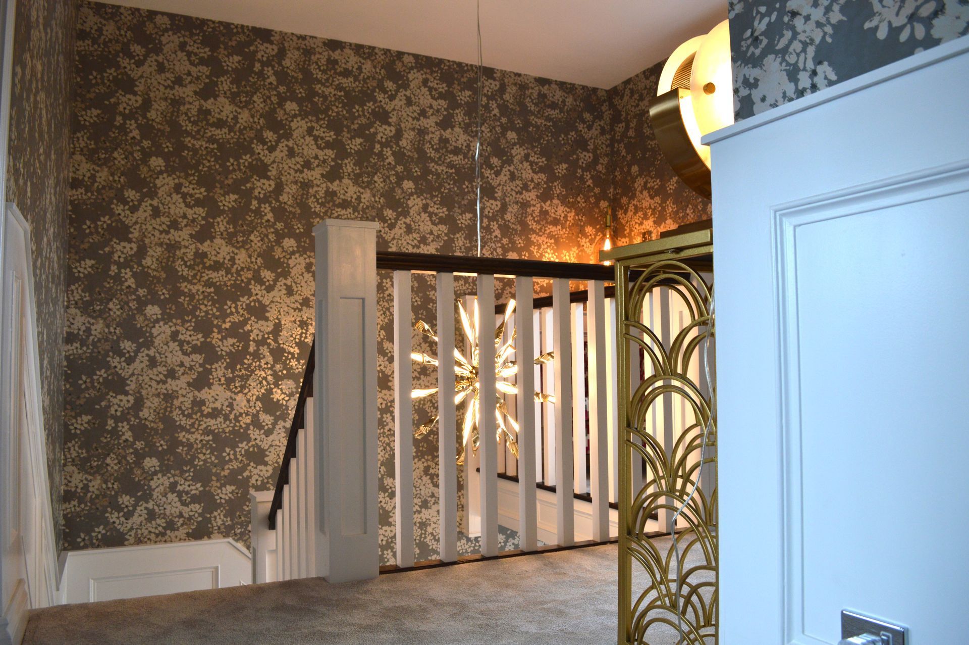 A hallway with stairs leading up to a living room