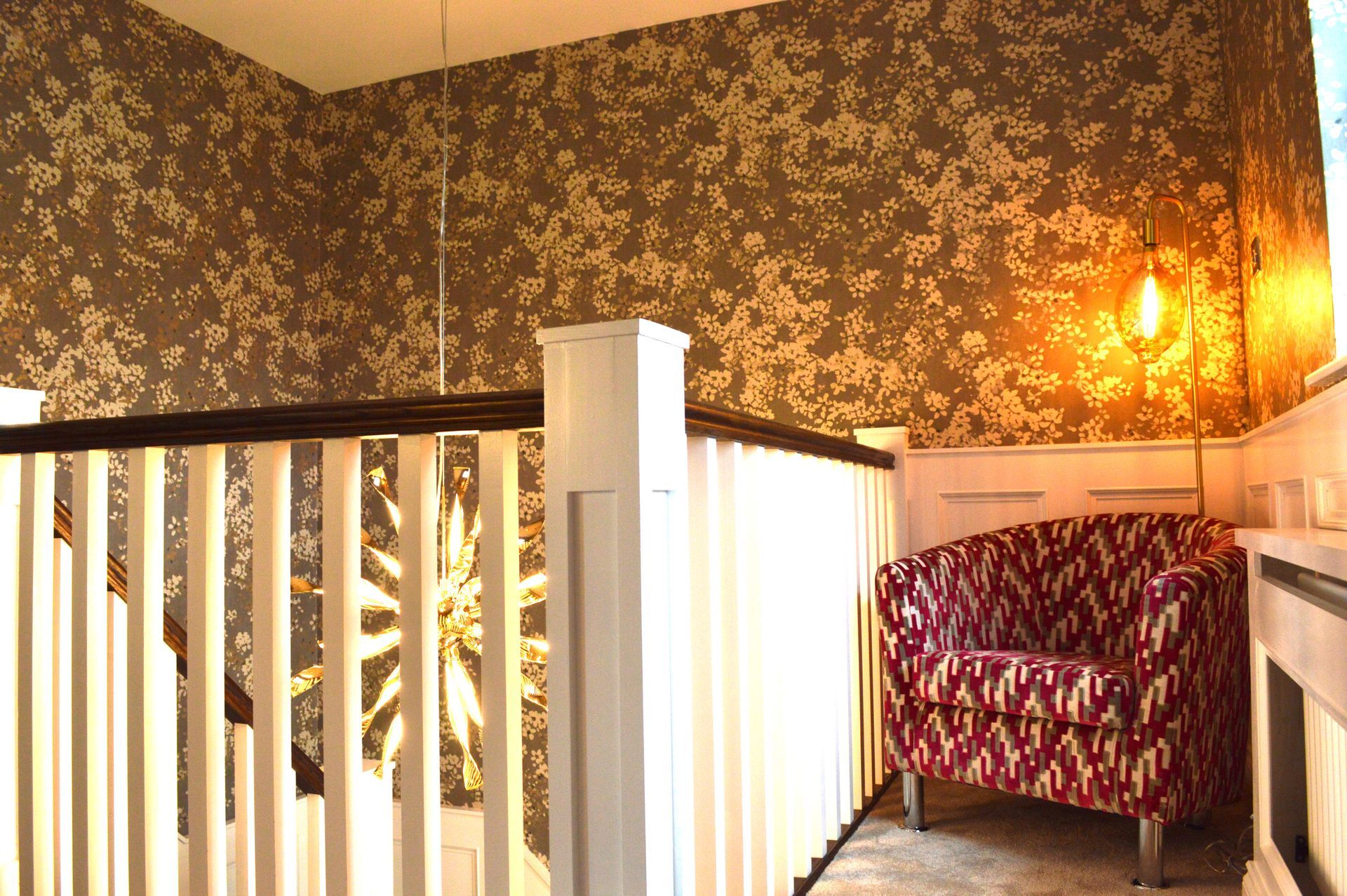 A chair is sitting on a staircase next to a railing.