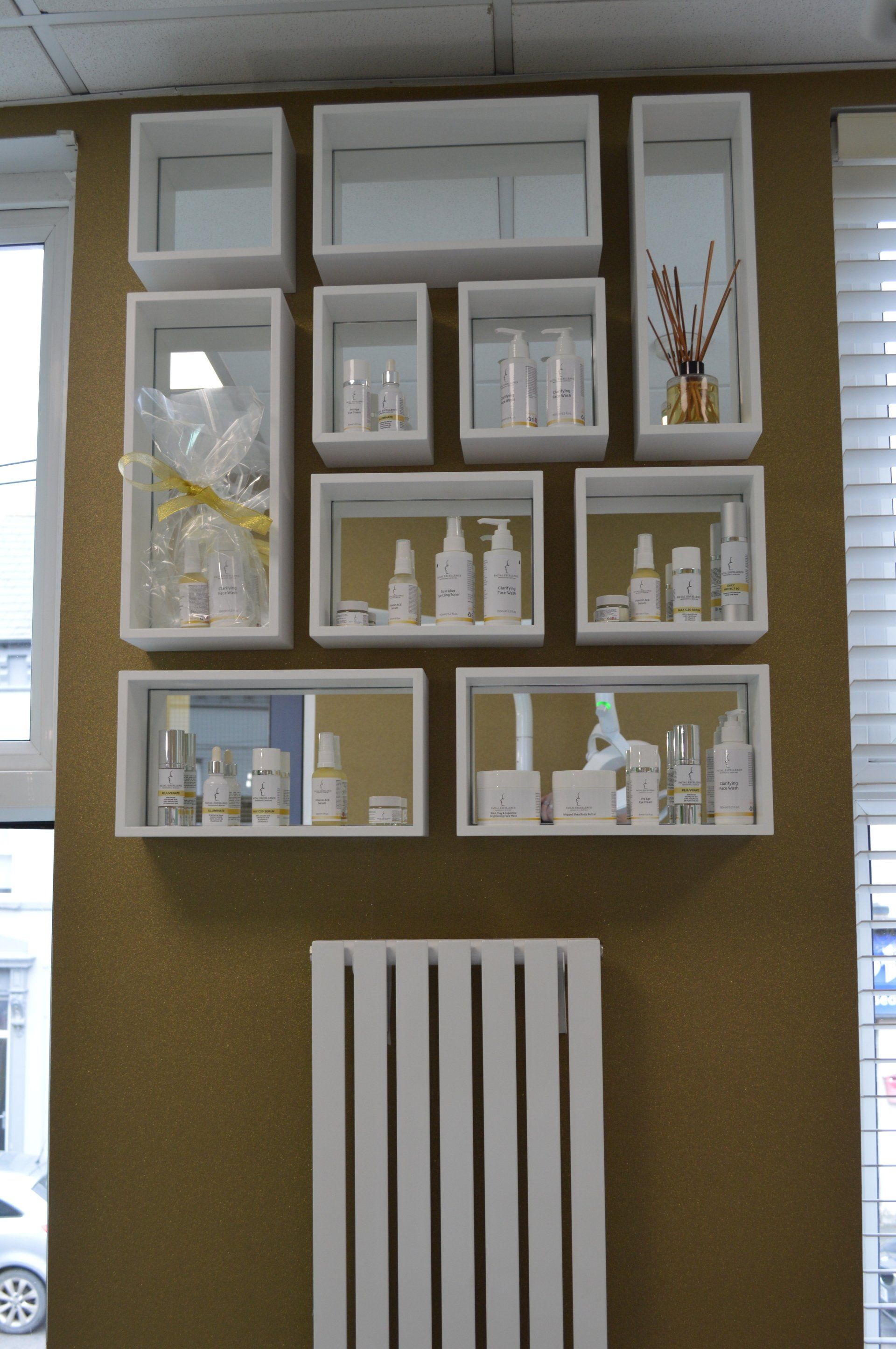 A wall with a lot of shelves filled with beauty products