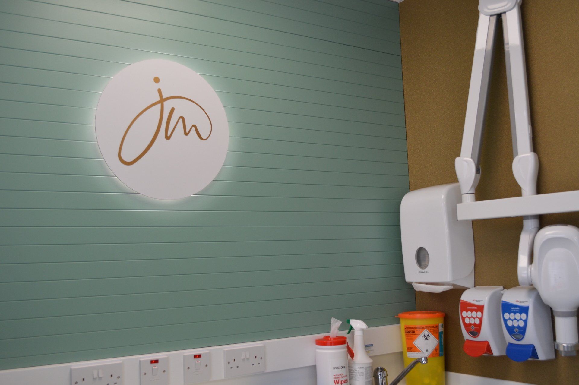 A dental office with a sign on the wall that says jm