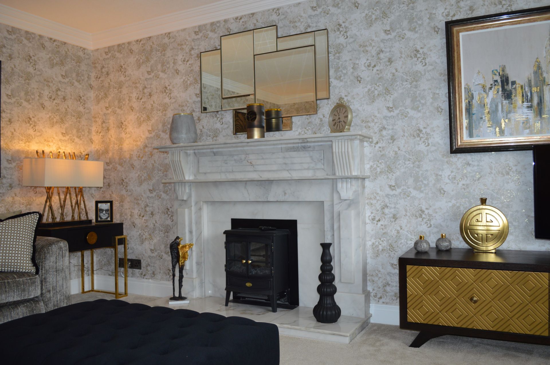 There is a fireplace in the middle of the living room.