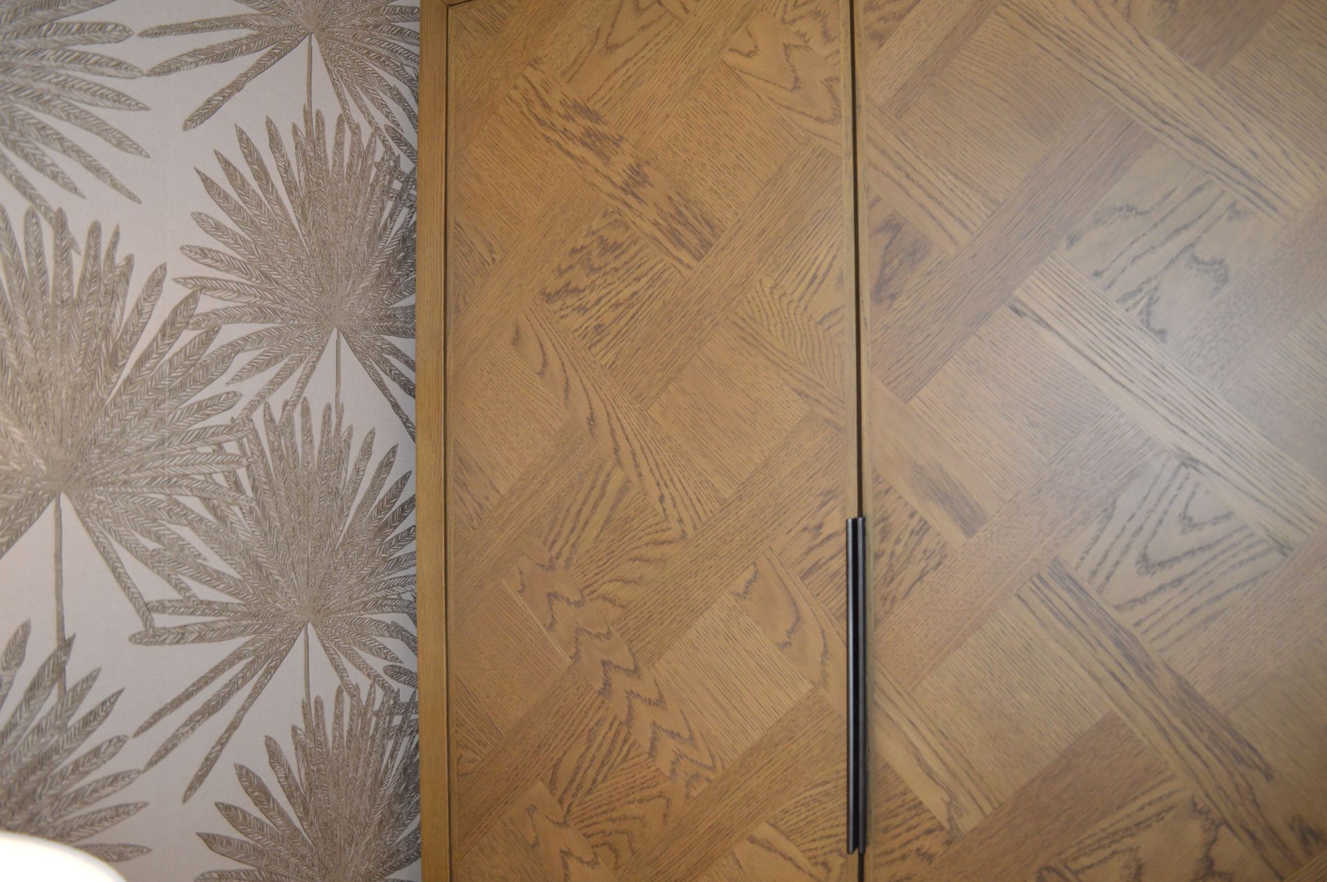 A close up of a wooden door with a pattern on it.